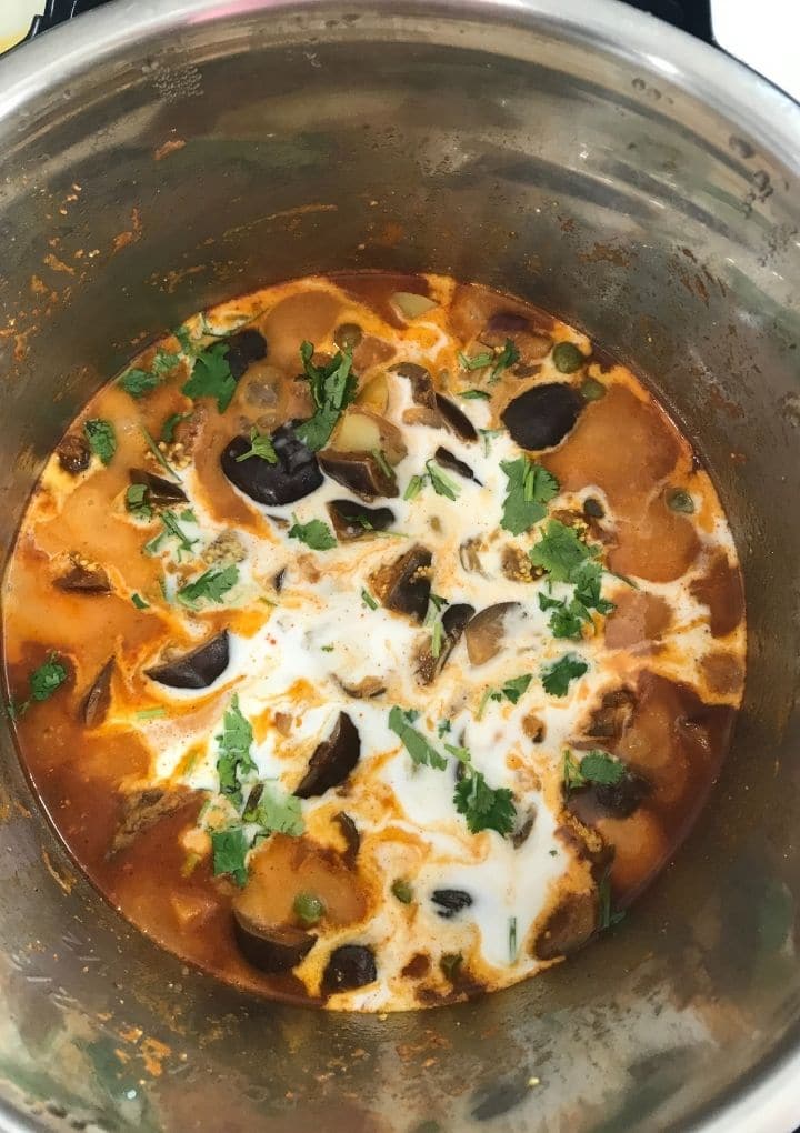 An instant pot filled with brinjal curry 
