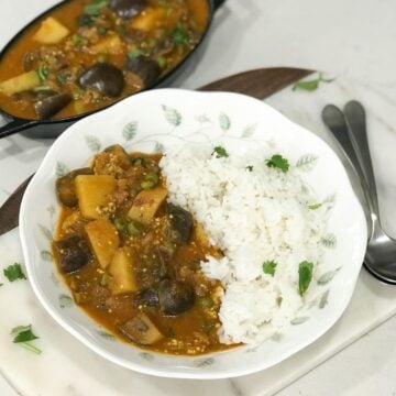 A black pot is filled with curry