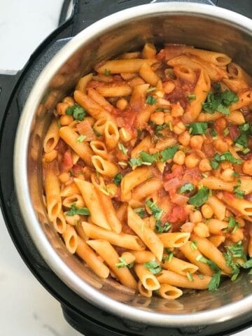 An instant Pot filled with masala pasta and chickpeas