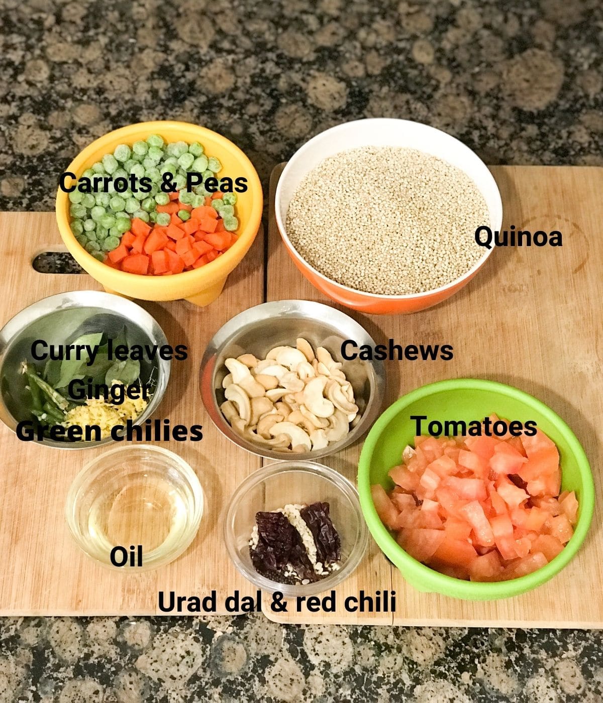 All the ingredients are placed on the counter for quinoa upma including quinoa, vegetables, tomatoes etc