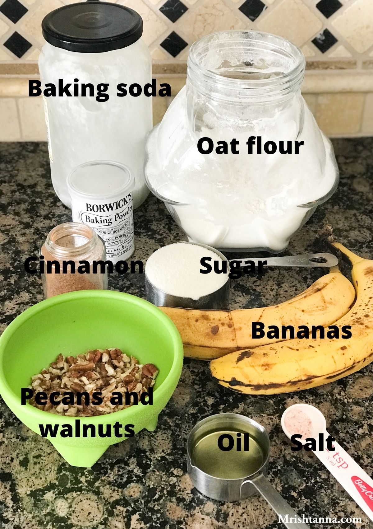 All the ingredients for muffins like oats flour, banana,oil, and sugar are on the surface