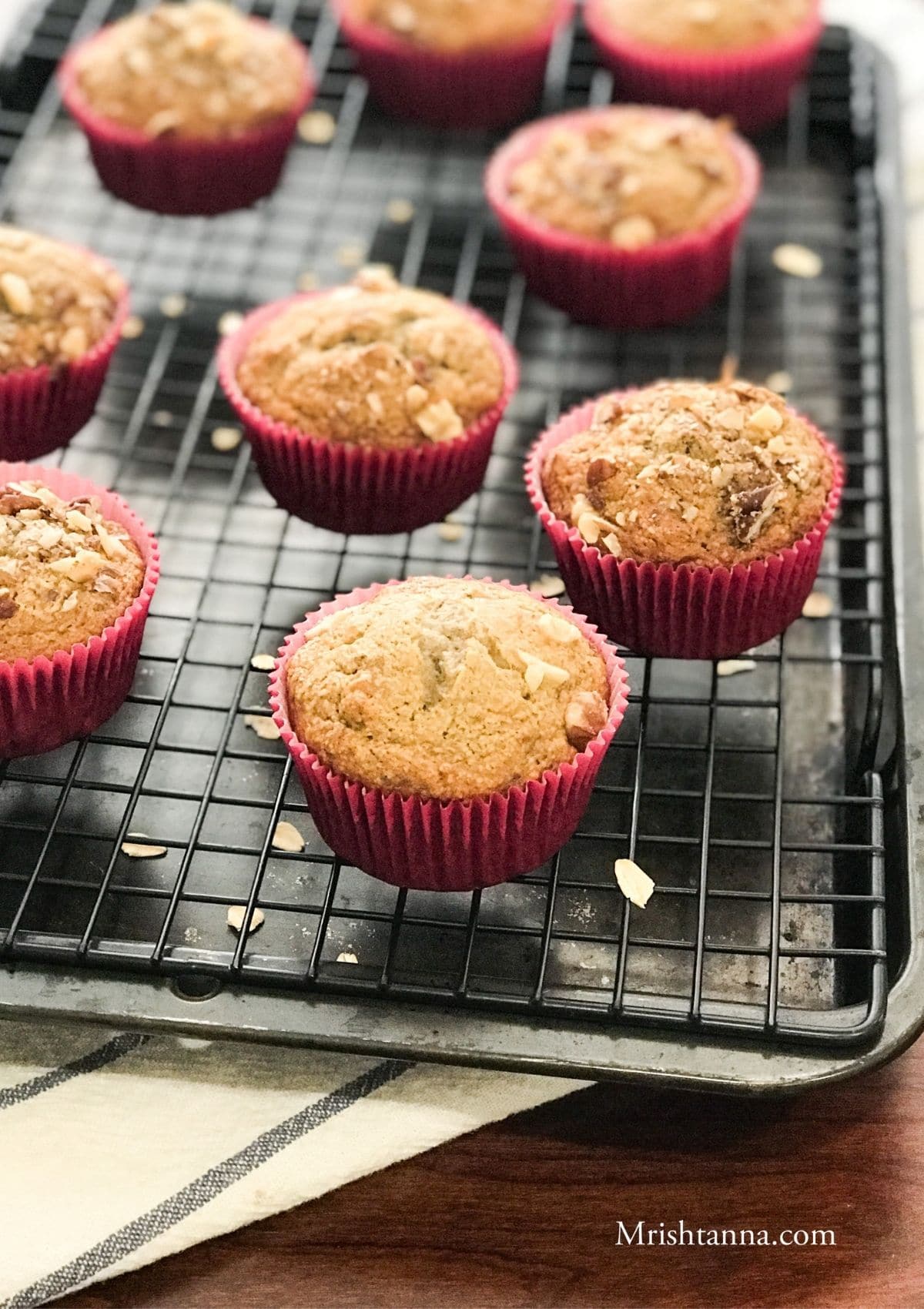 Banana oat muffins are placed on the cooling wire rack