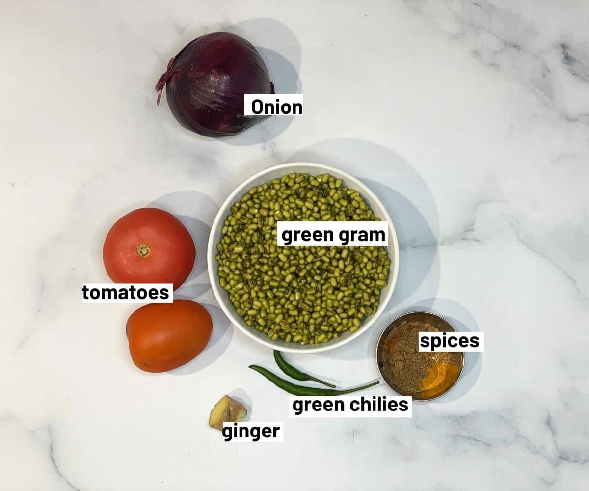 Green moong dal ingredients are on the marble table.