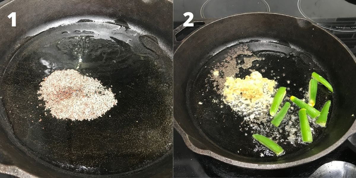 A cast iron pan is on the stove top filled with oil and mustard seeds