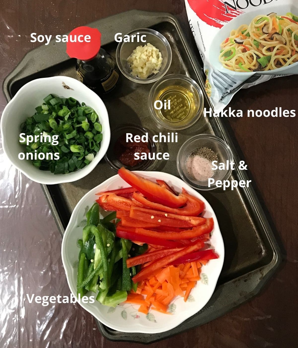 All the hakka noodles ingredients are placed on the counter tops