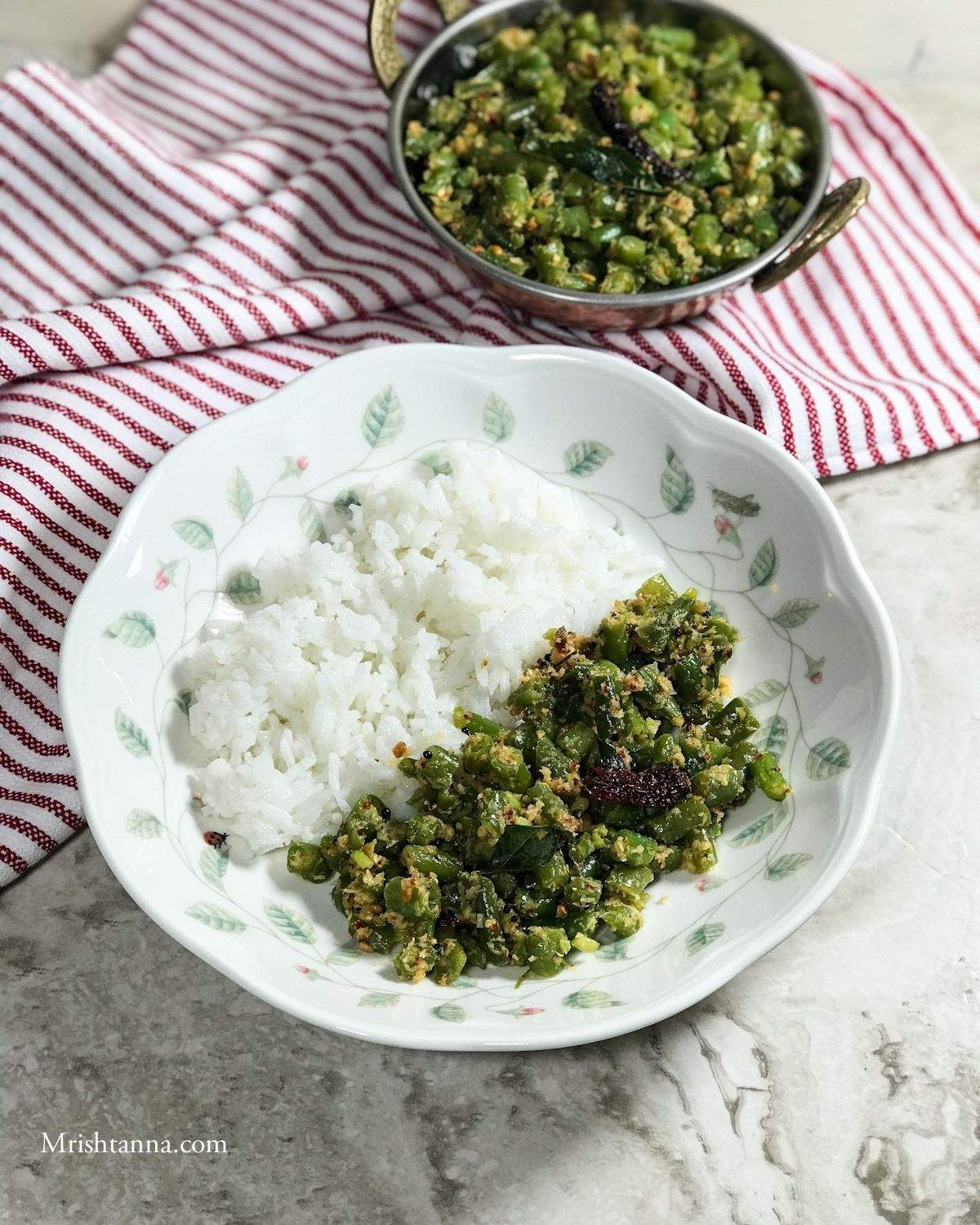 A plate is with rice and beans stir fry on the table