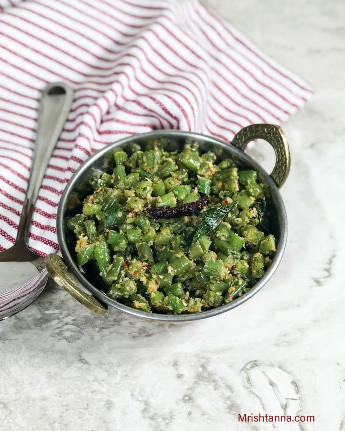 A bowl of beans palya is on the table 