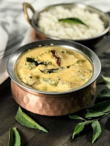 A bowl of aviyal curry is on the table