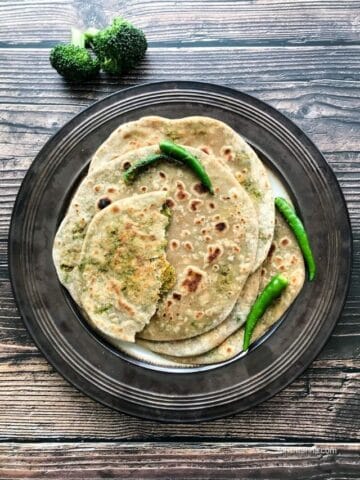 A plate of broccoli paratha is on the table