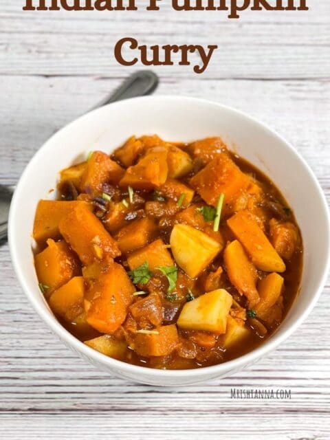 A bowl of pumpkin curry is on the table