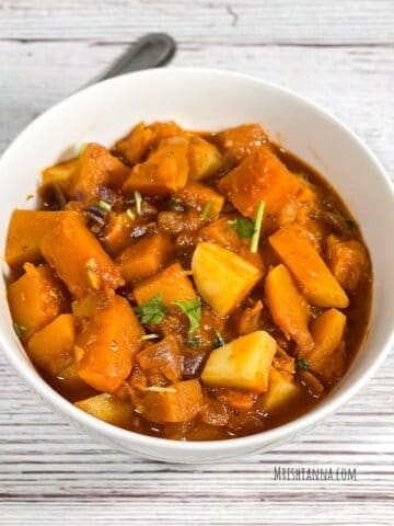 A close up of bowl with Indian pumpkin curry