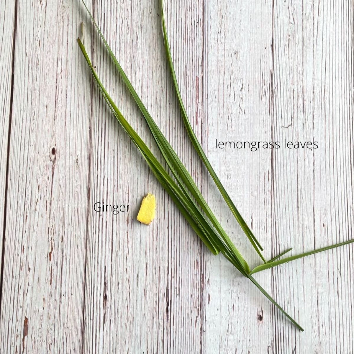 lemongrass leaves, and ginger root is on the table.