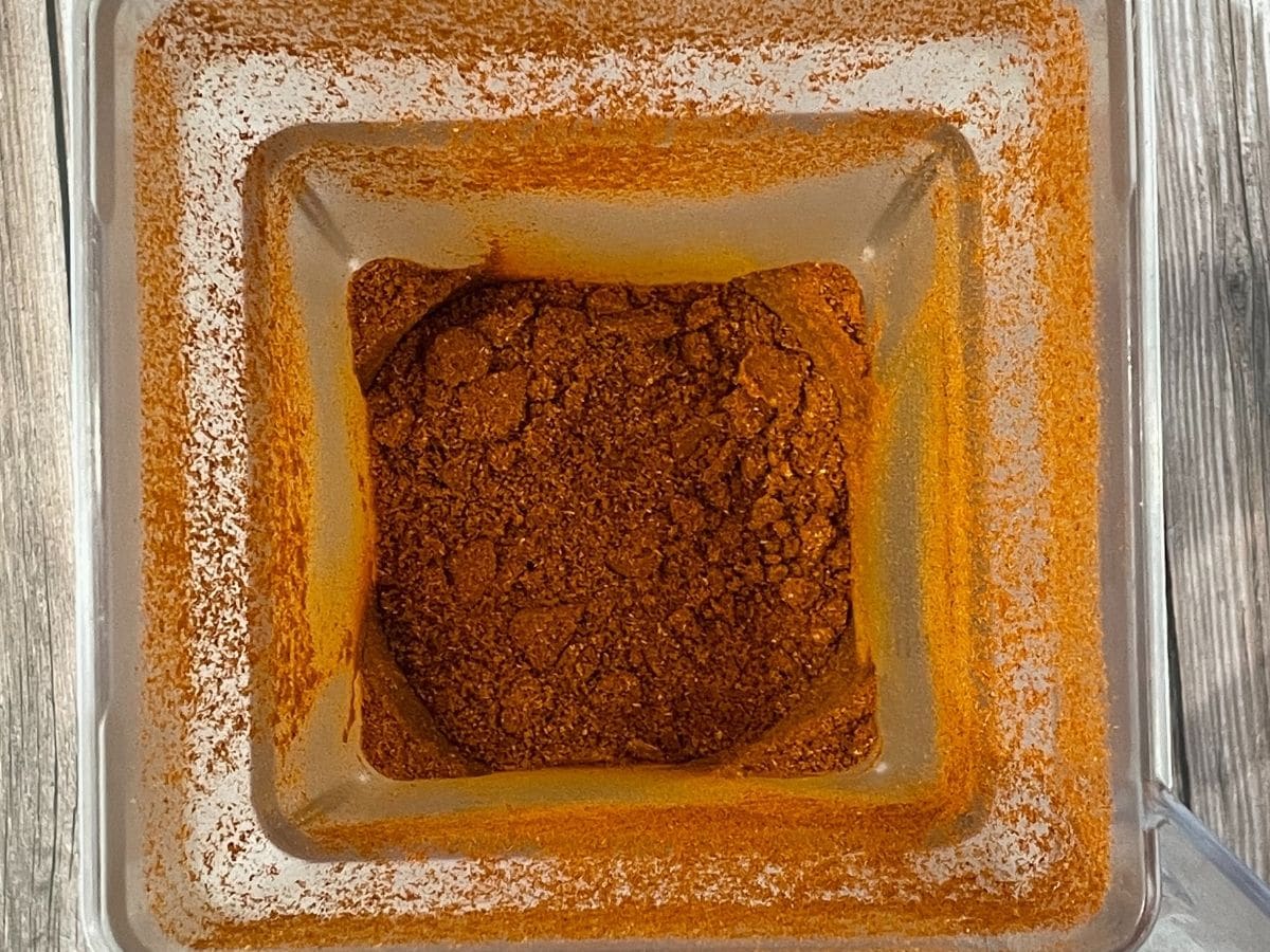 Powdered rasam mix is inside the blender