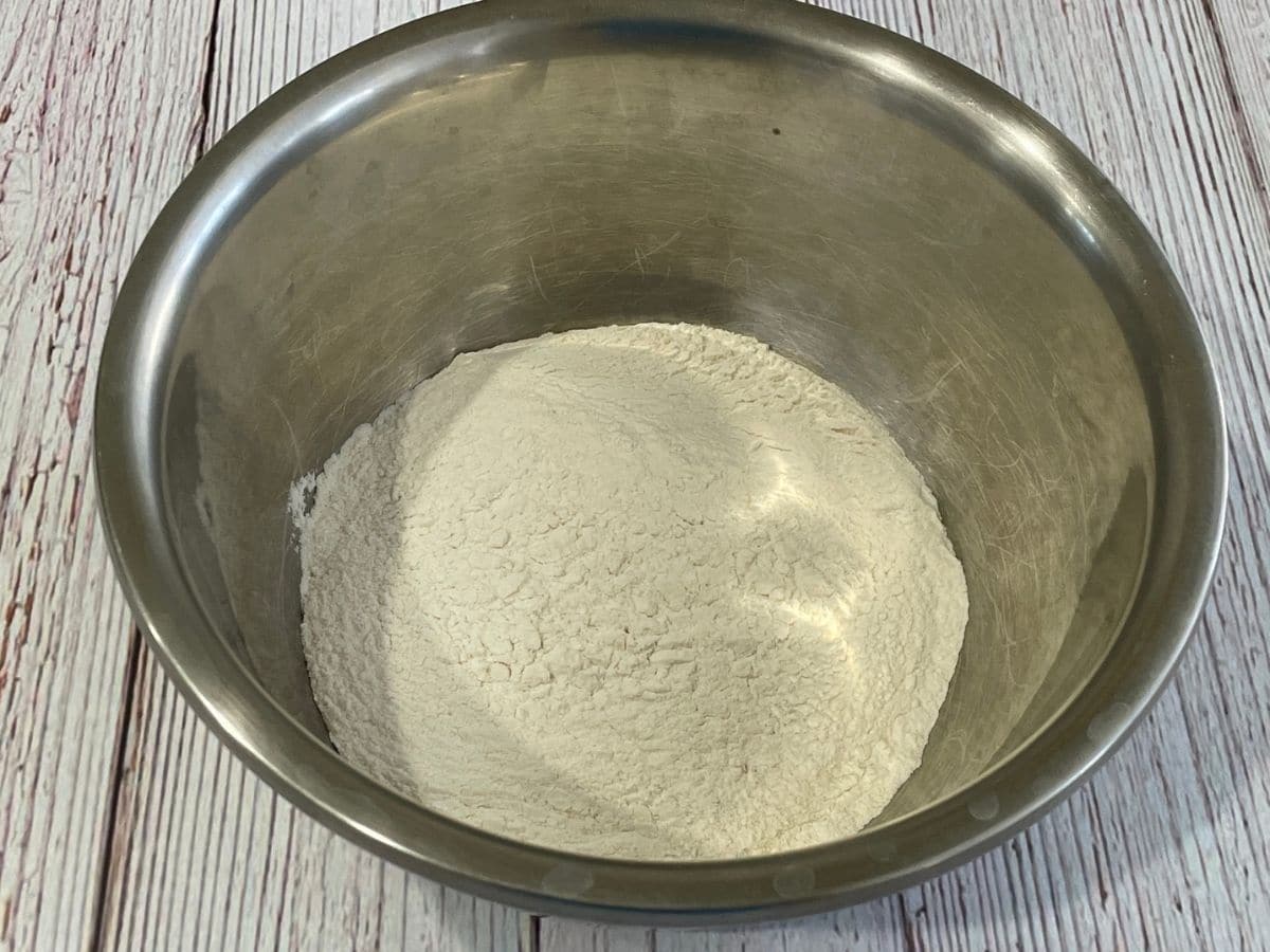 A bowl is with dry ingredients to make karjikai dough.