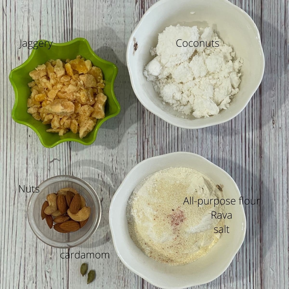 Bowls of karjikai ingredients are on the table like flour, coconut, and jaggery.