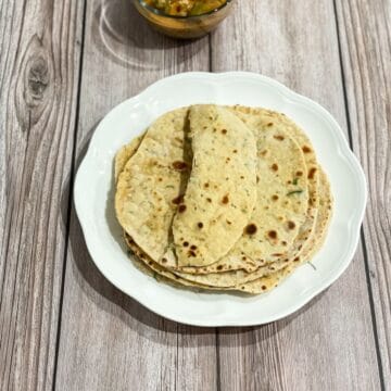 a plate of besan roti is on the table