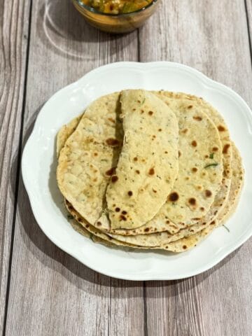 a plate of besan roti is on the table