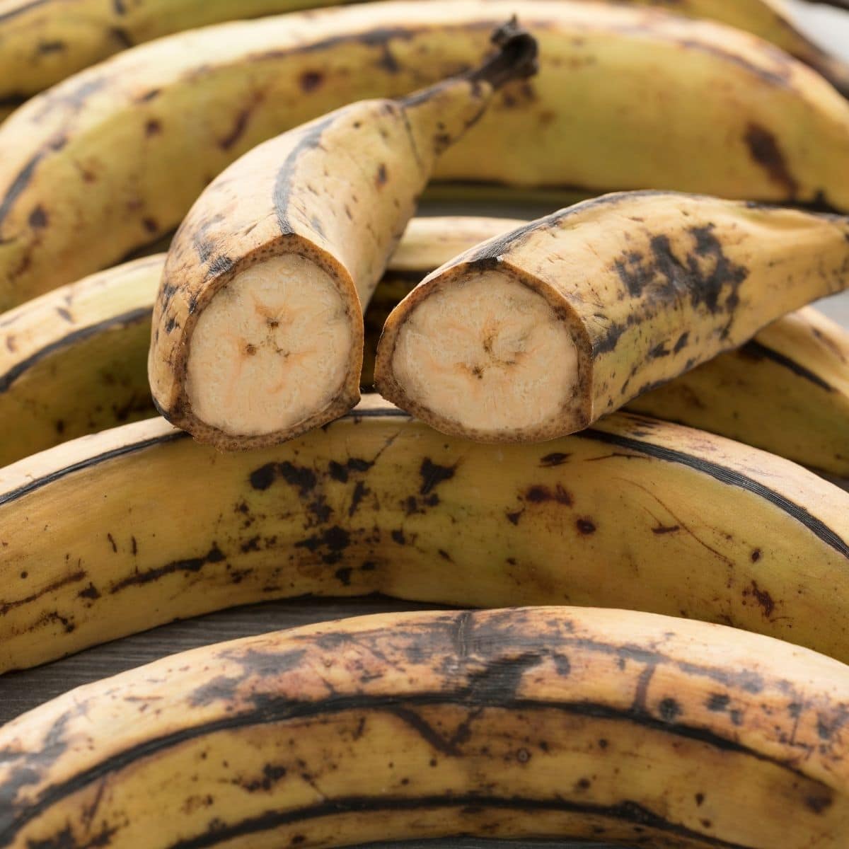 Ripe plantains divide in to half and placed on the whole plantains.