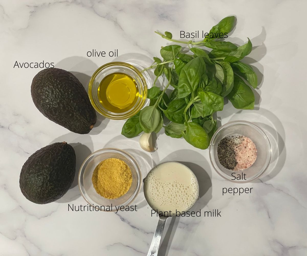 Ingredients to make avocado pasta are on the table.