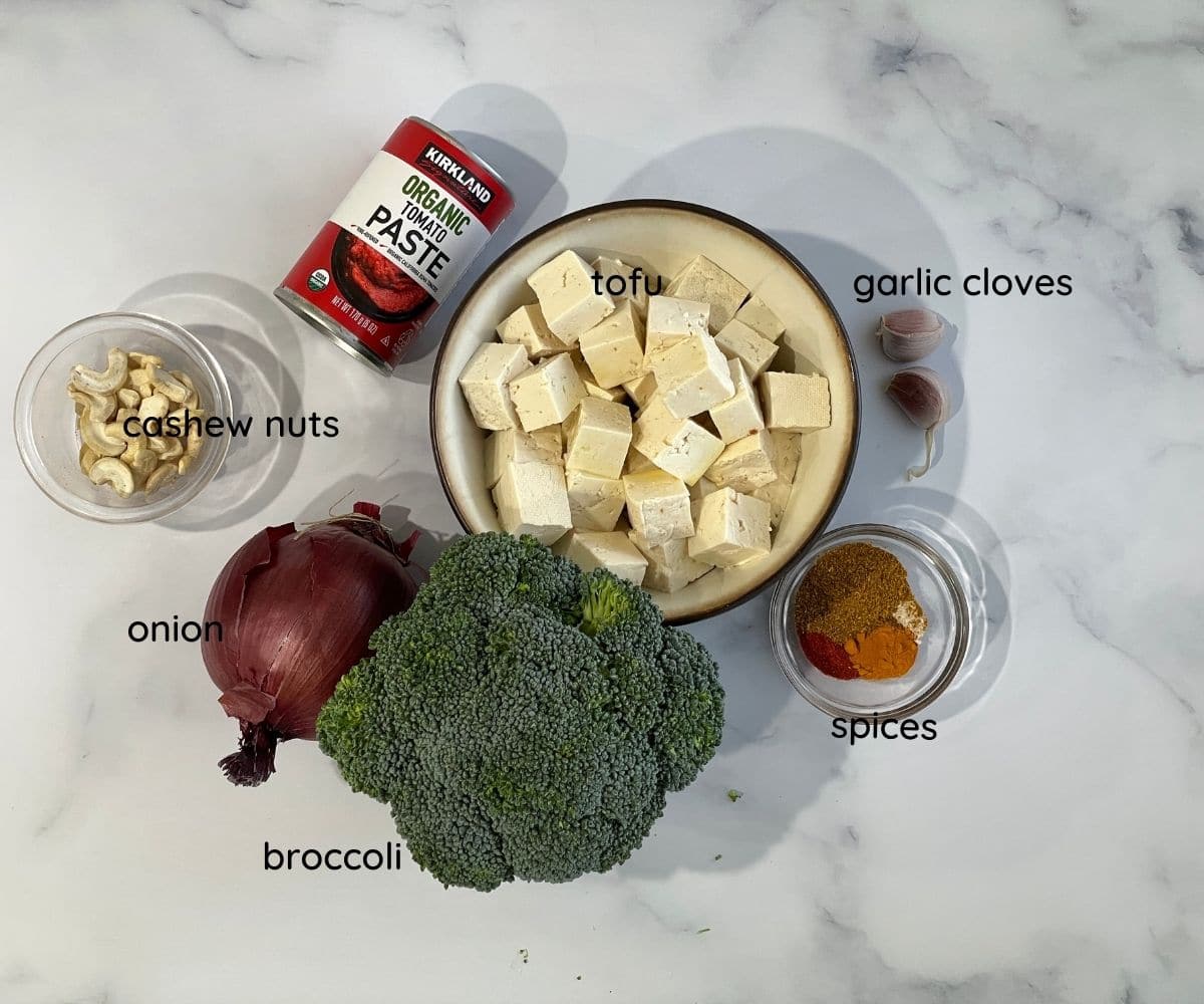 broccoli curry ingredients are on the flat surface.