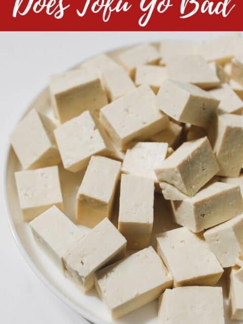 a plate is with cubed medium firm tofu.