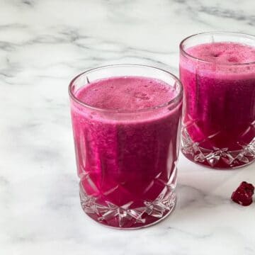 A glass of pitaya juice is on the table.