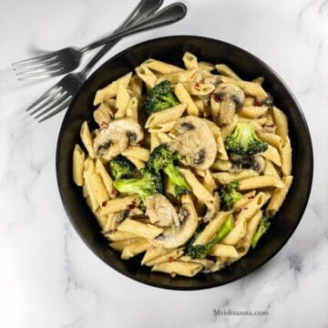 head shot of broccoli and mushroom pasta dish.