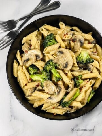 head shot of broccoli and mushroom pasta dish.