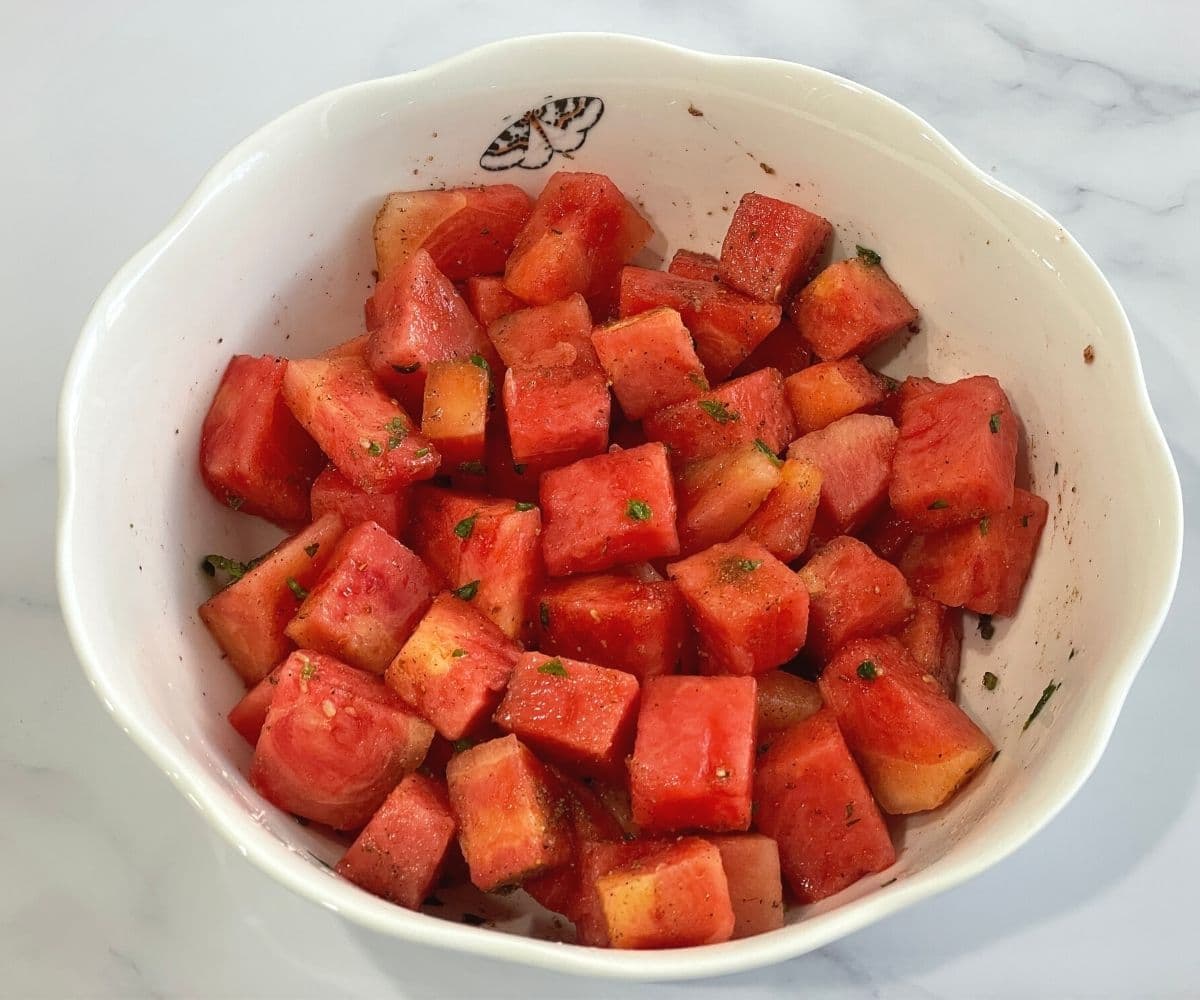 A bowl is with watermelon salad.