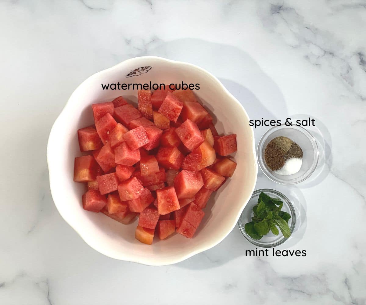 Watermelon chaat ingredients are on the table.