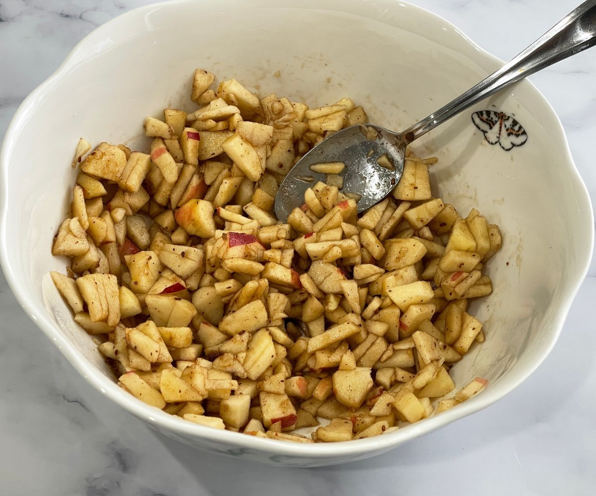 Apple turnovers filling is in a bowl.