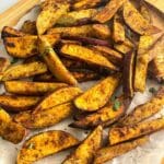 close up of air fryer sweet potato sweet wedges.