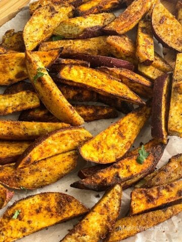 close up of air fryer sweet potato sweet wedges.