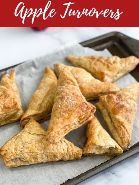 Air fried apple turnovers are on the baking tray.