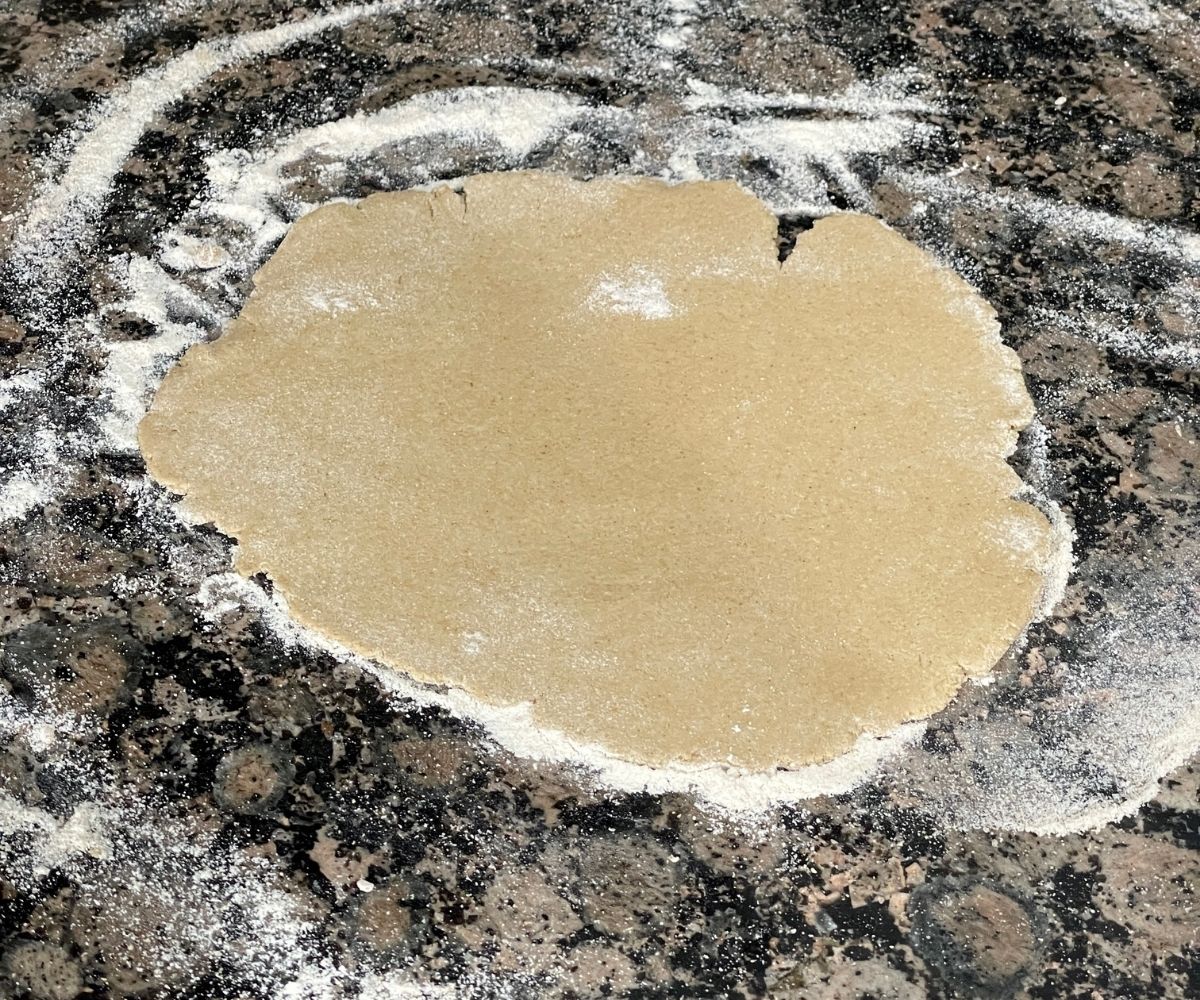 rolled gluten free roti dough is on the surface.