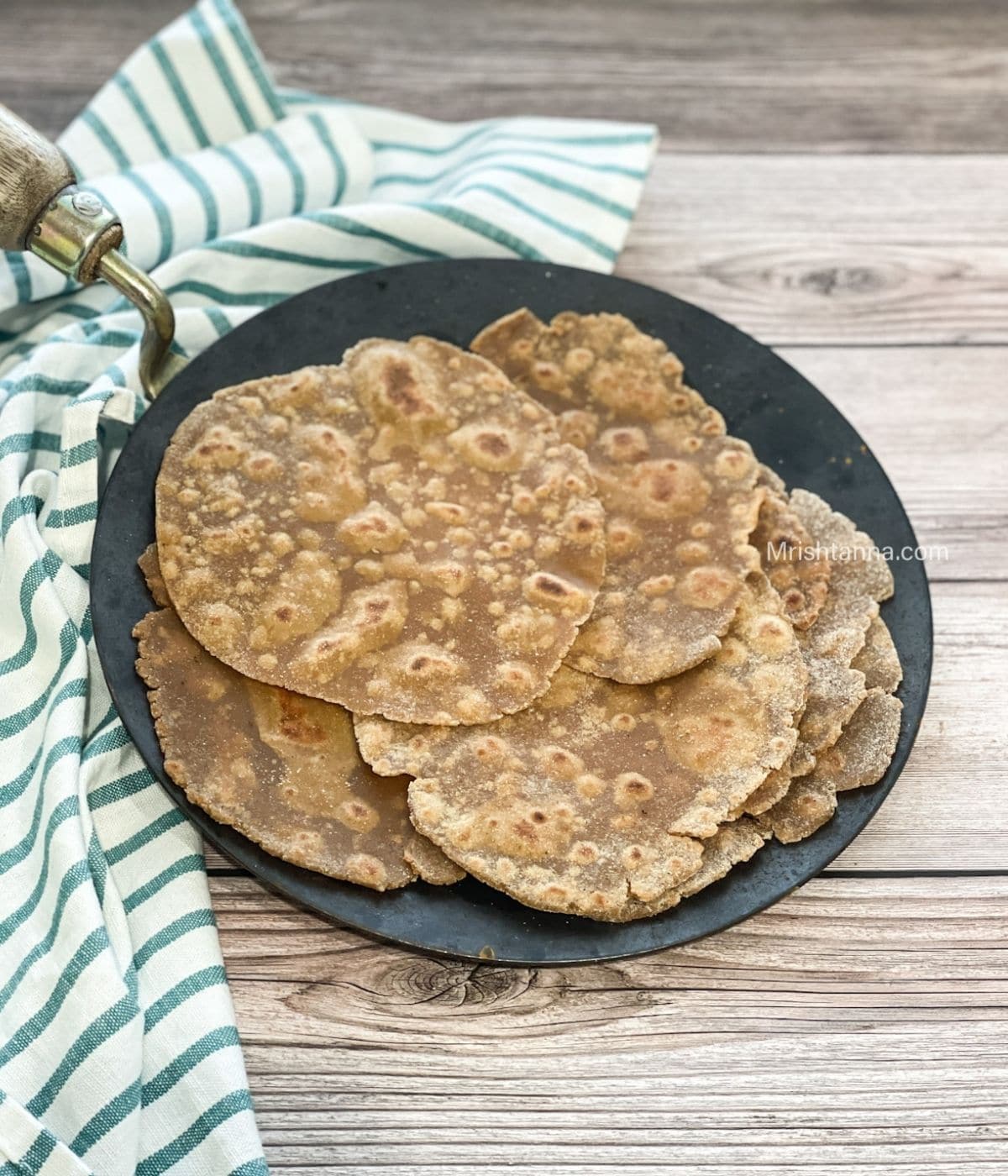 A pan is with gluten free chapatis.