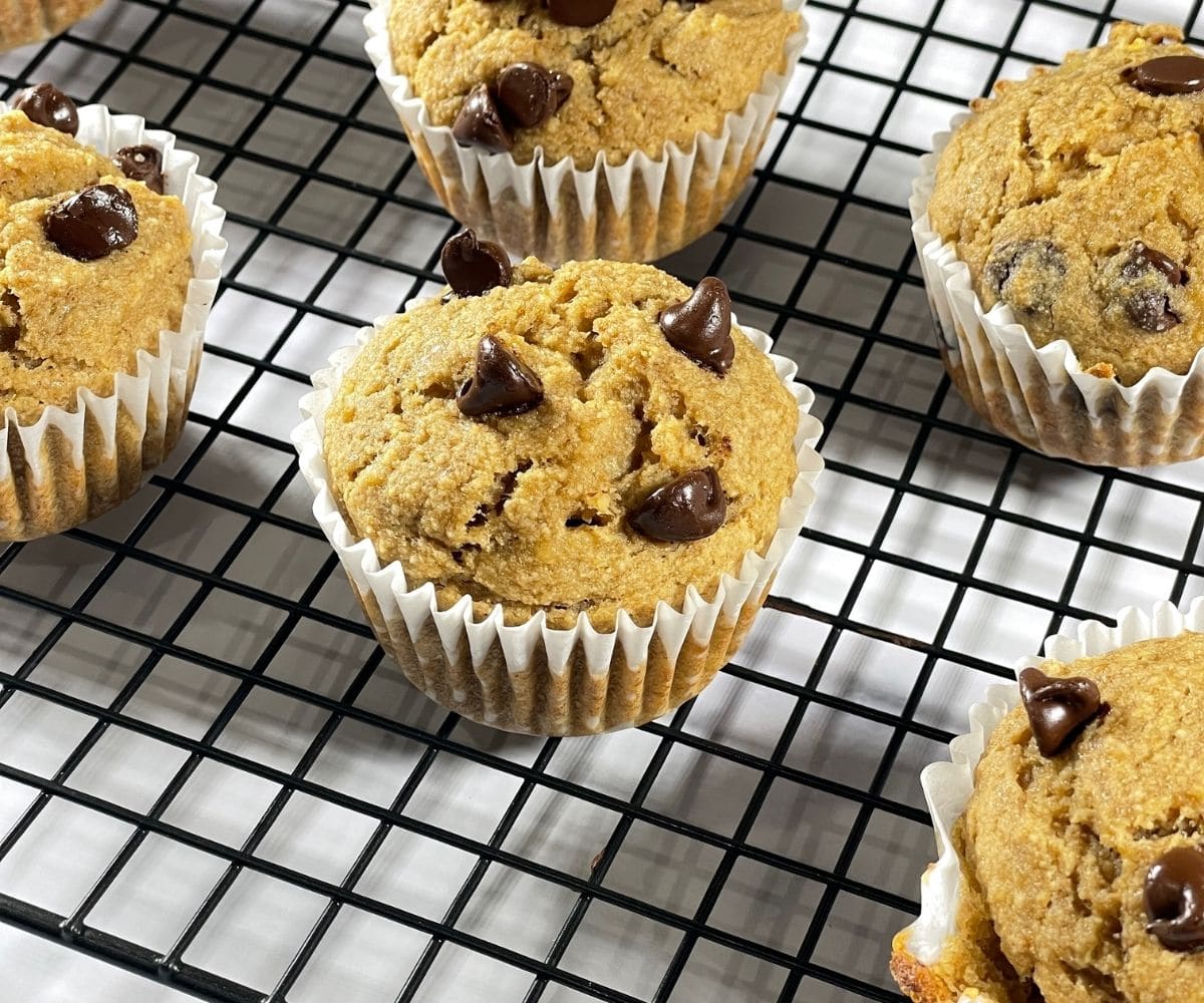 Gluten free vegan banana muffins are placed on the wire rack.