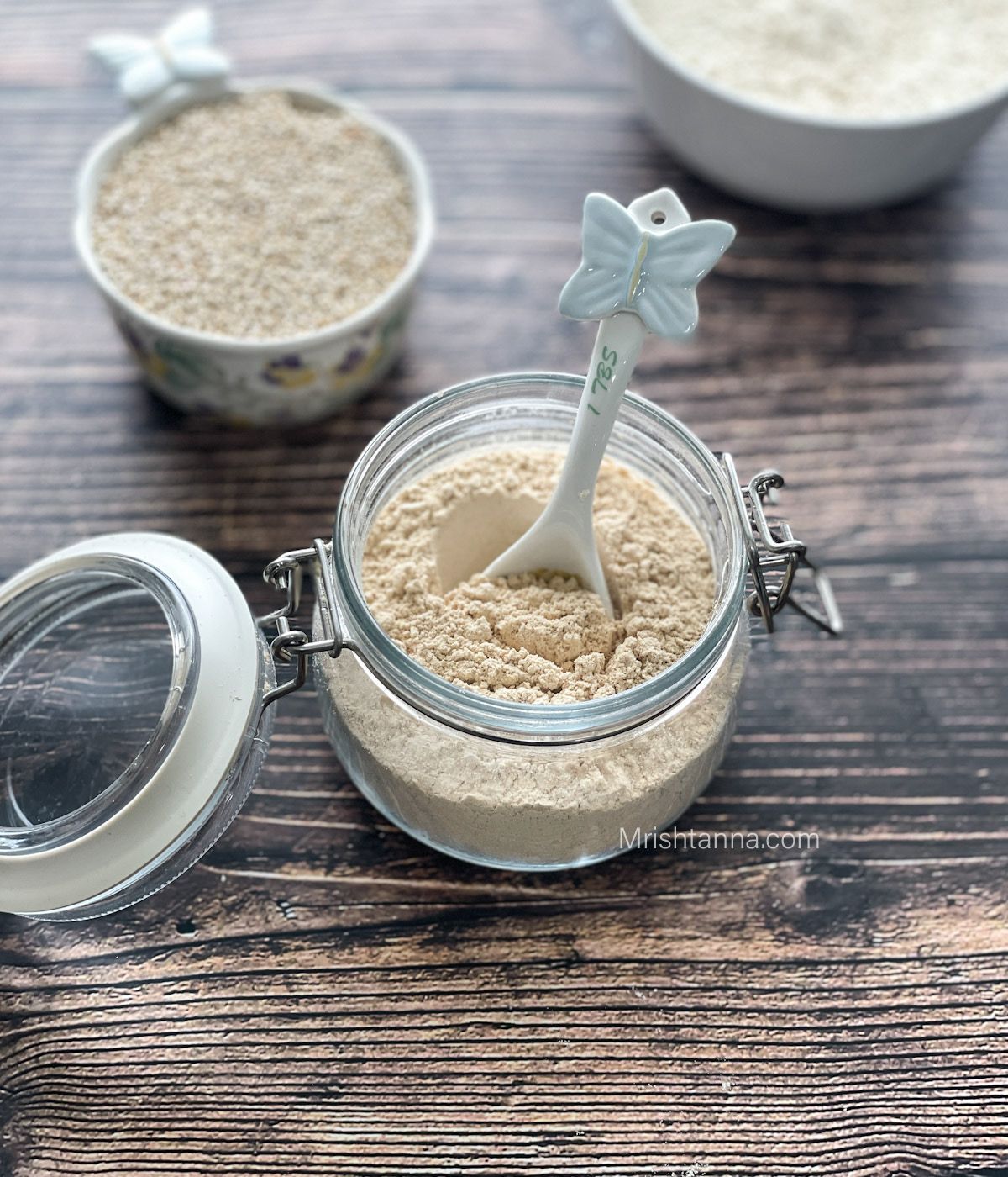 A jar is filled with quinoa flour.