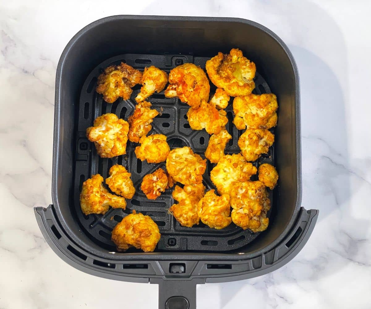 The air fryer basket is with fried gobi 65.