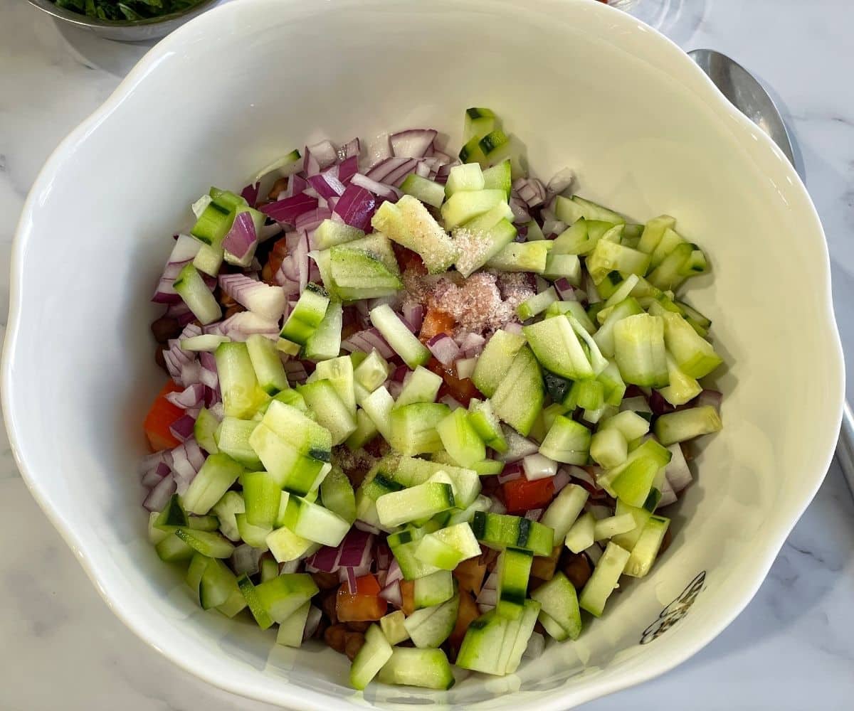 A bowl is with vegetables and black chana.