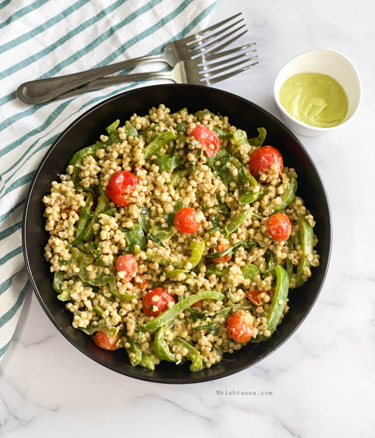 head shot of sorghum salad with cherry tomatoes.