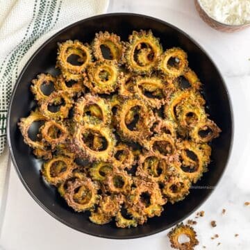 Head shot of karela chips on the plate.