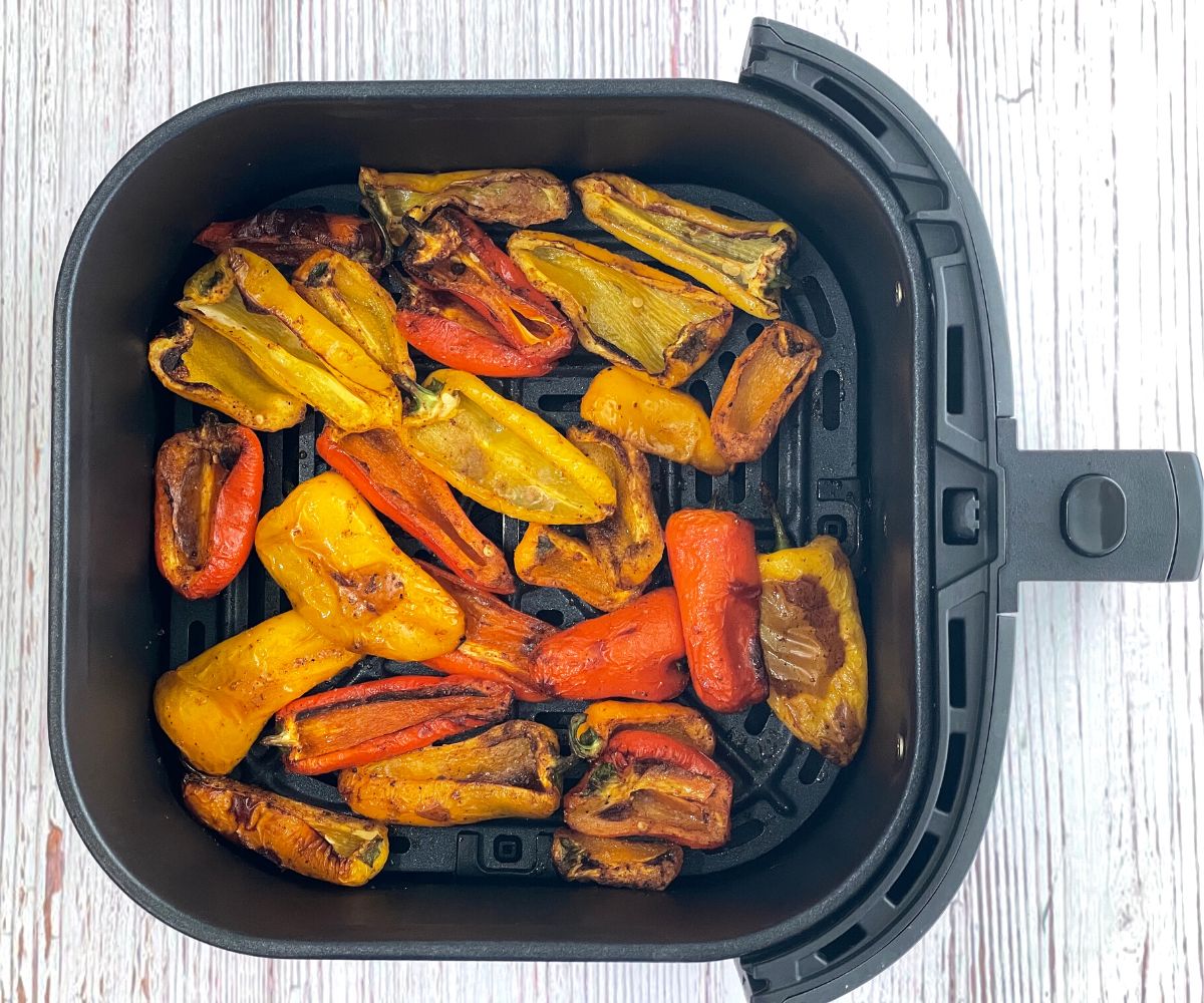 Air fried mini peppers are inside the basket.