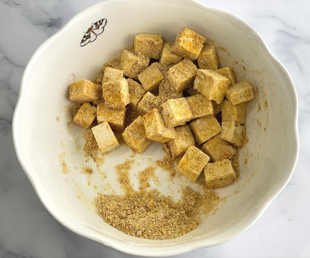 A bowl is with tofu nuggets mixture.