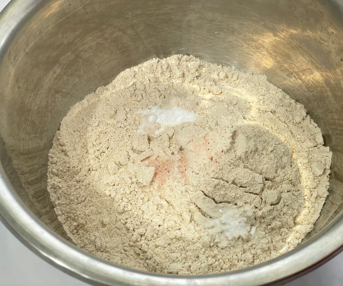 A large bowl is with flour and salt for cookies.