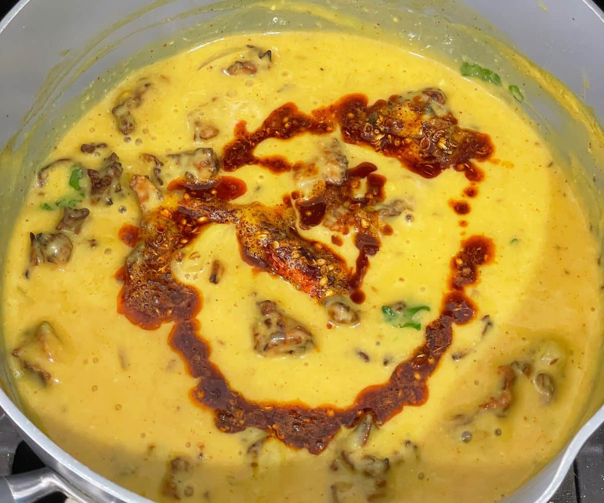 A pot is with Punjabi kadhi pakora curry.