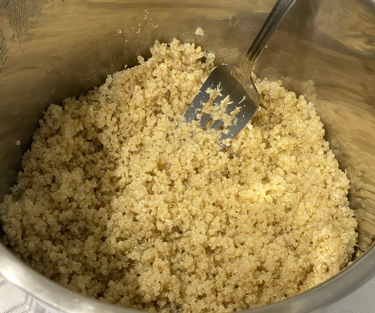 An instant pot is filled with cooked quinoa.