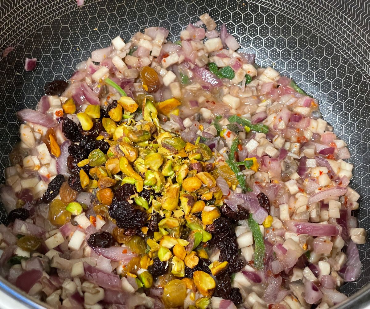 A pot is with acorn squash stuffing mixture.