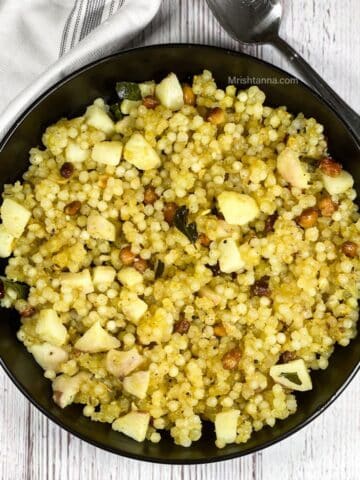 A plate of sabudana upma is on the table.