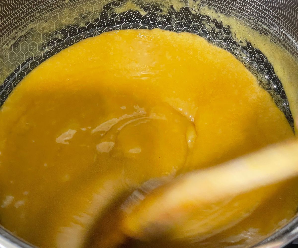 Stirring continuously the mysore pak mixture over the heat.